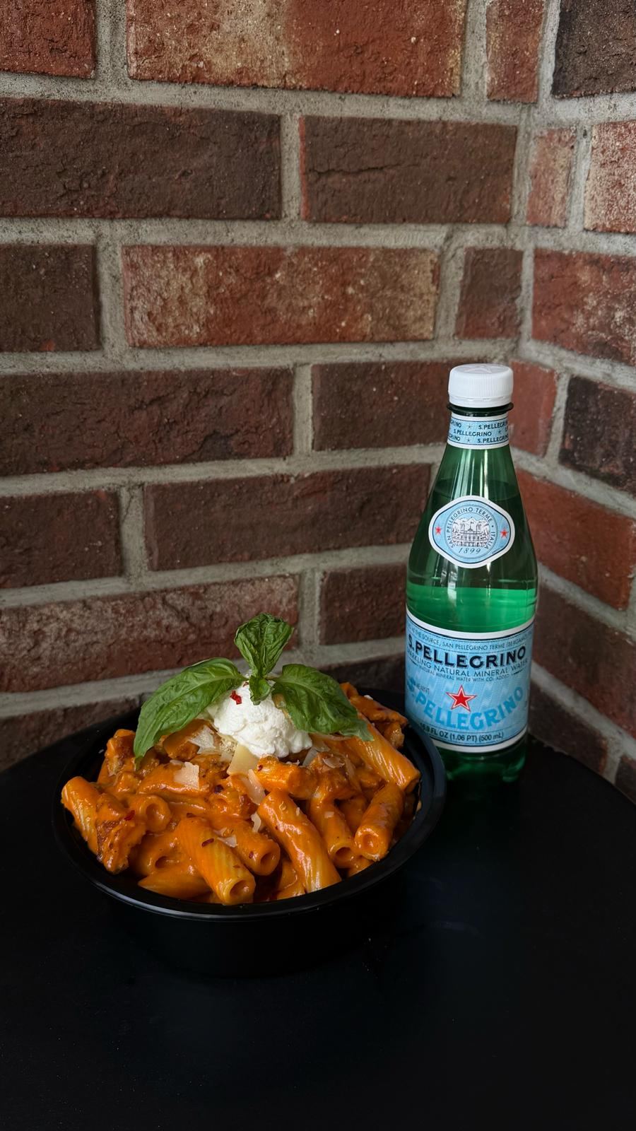 Rigatoni vodka pasta bowl with ricotta and basil