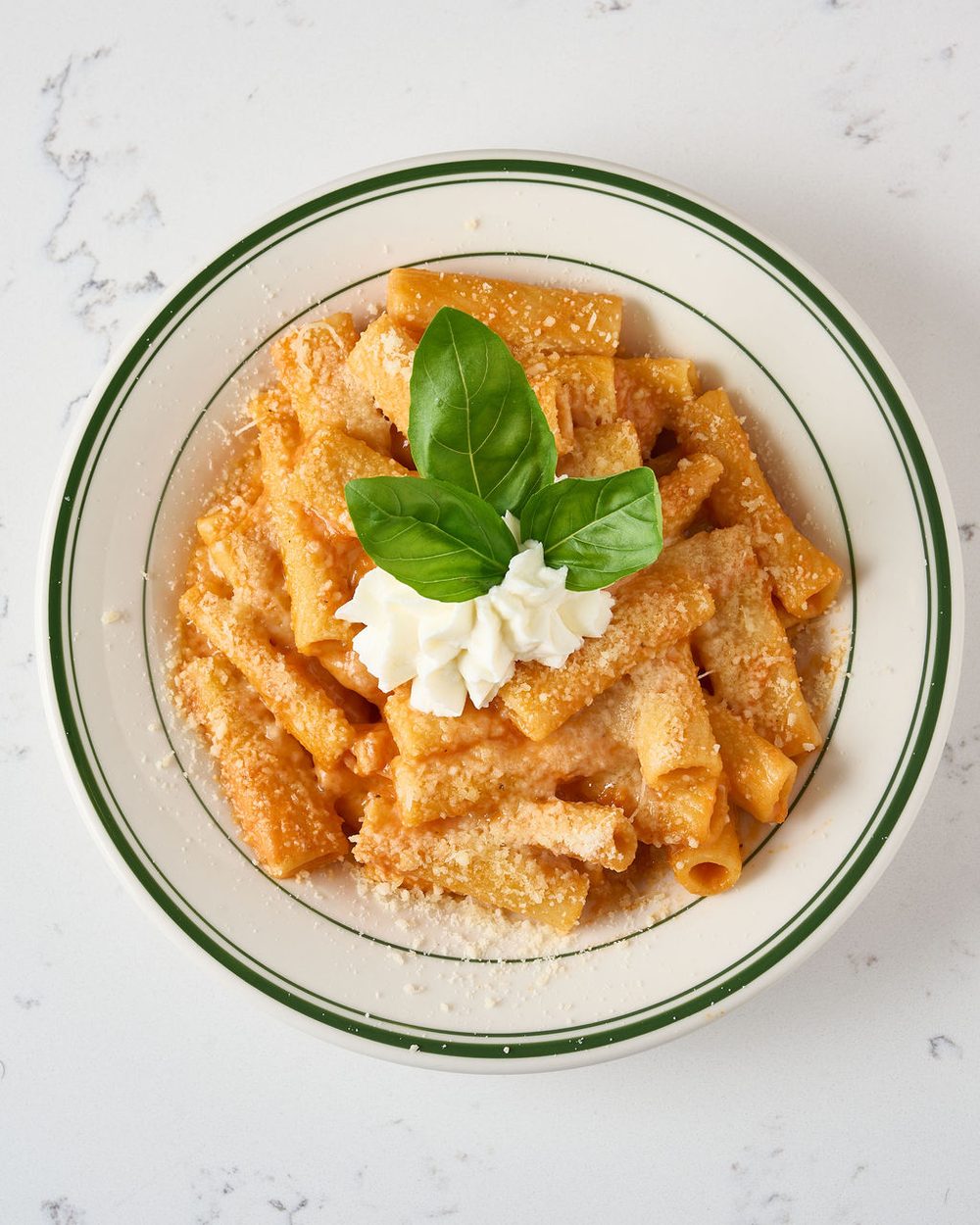 Rigatoni vodka pasta bowl with ricotta and basil